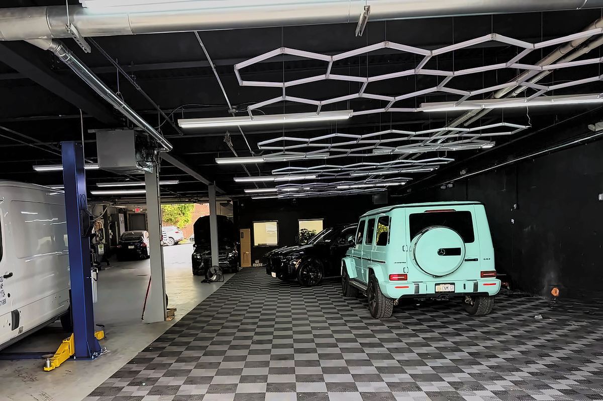 BMW X7 and G-Wagen on the checkerboard floor