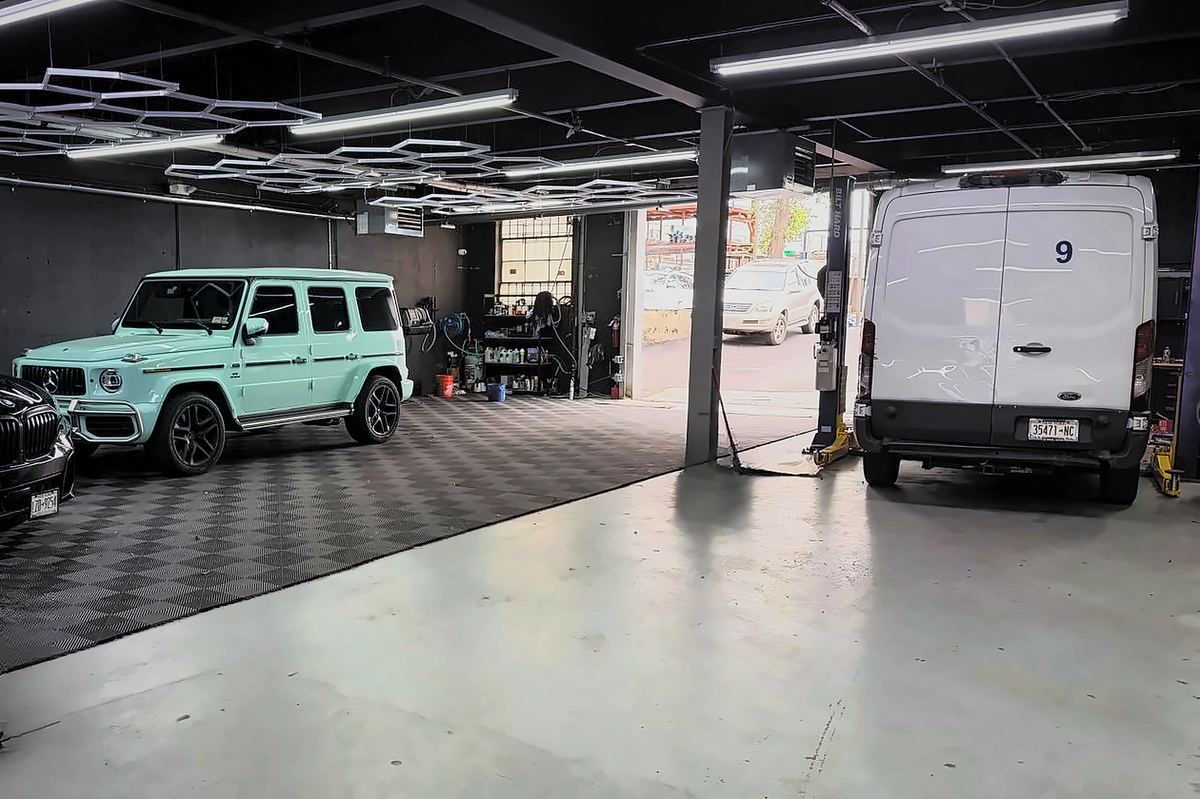 Mint G-Wagen and service van under the honeycomb LED ceiling