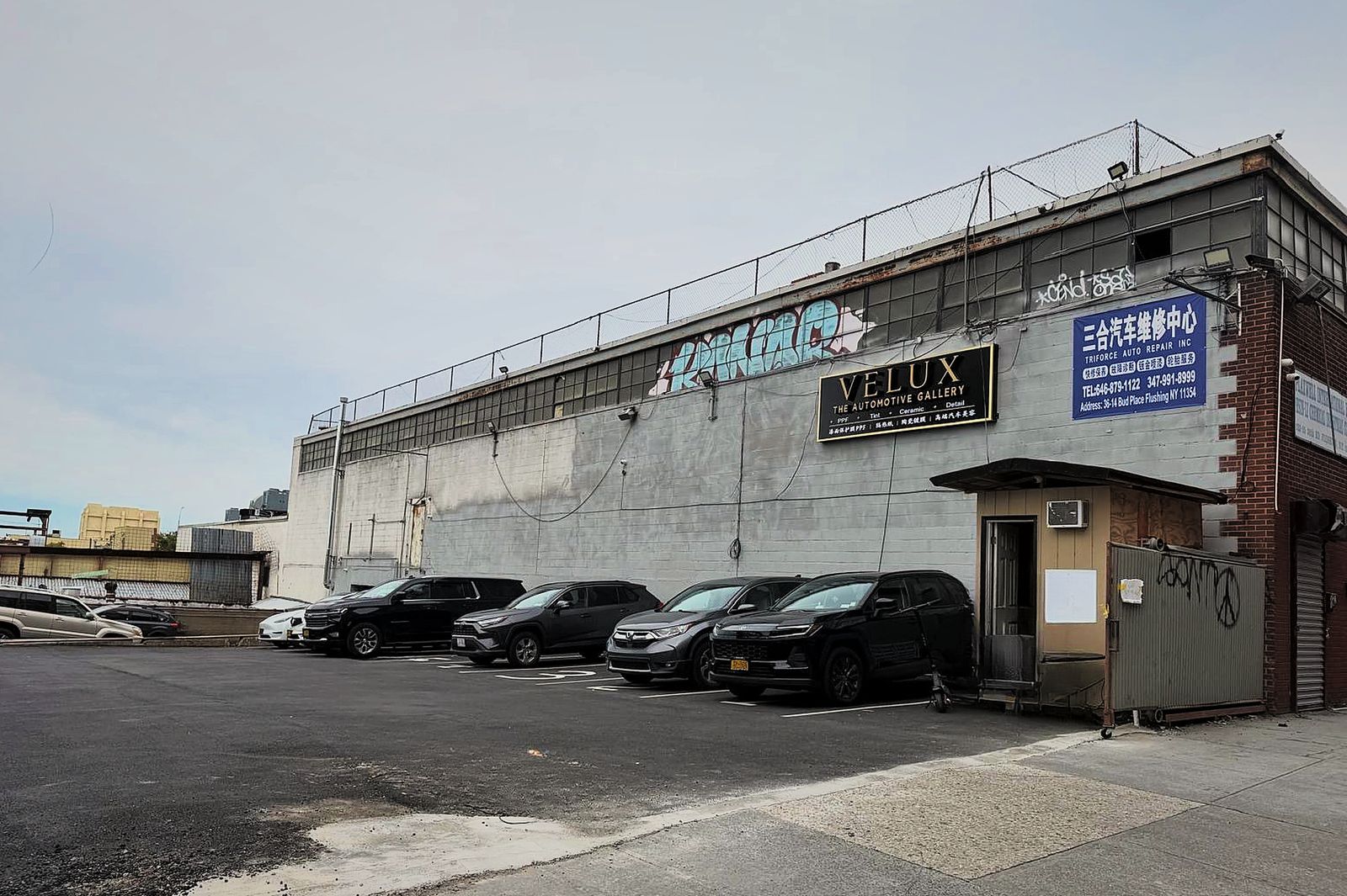 Triforce Auto Repair storefront with signage and parking lot